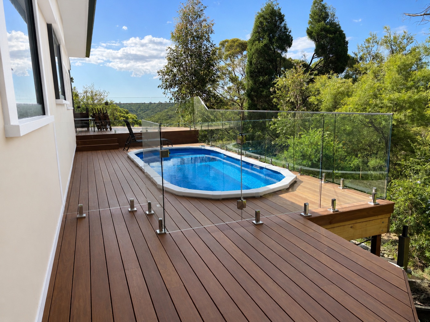 Composite deck with glass pool fencing