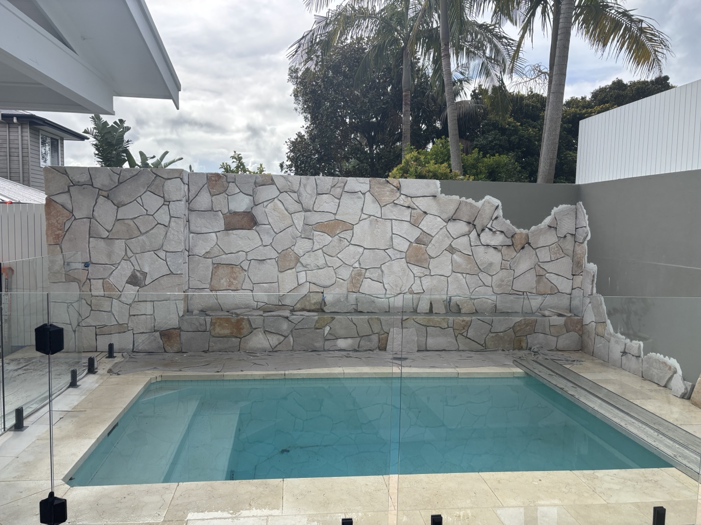 Pool surround stone feature wall under construction